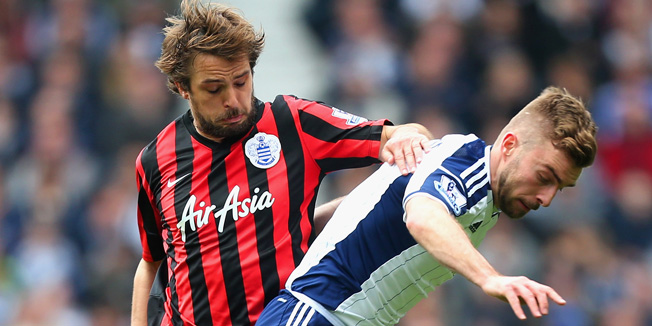 WEST BROMWICH, ENGLAND - APRIL 04:  Niko Kranjcar of QPR and James Morrison of West Brom battle for the ball during the Barclays Premier league match West Bromwich Albion and Queens Park Rangers at The Hawthorns on April 4, 2015 in West Bromwich, England.  (Photo by Ben Hoskins/Getty Images)