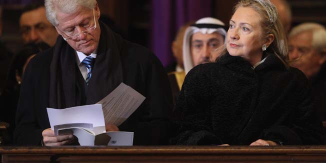 PRAGUE, CZECH REPUBLIC - DECEMBER 23:  Former U.S. President Bill Clinton and current U.S. Secretary of State Hillary Clinton attend the state funeral of former Czech President Vaclav Havel at St. Vitus Cathedral on December 23, 2011 in Prague, Czech Republic. International heads of state and thousands of mourners came to pay their last respects  to the dissident playwright who led the Velvet Revolution that forced communist rule in Czechoslovakia to crumble in 1989, and died in the early morning of December 18 in his sleep at the age of 75.  (Photo by Sean Gallup/Getty Images)