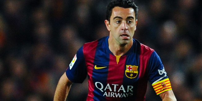 BARCELONA, SPAIN - MARCH 22:  Xavi Hernandez of FC Barcelona a runs with the ball during the La Liga match Between FC Barcelona and Real Madrid CF at Camp Nou on March 22, 2015 in Barcelona, Spain.  (Photo by David Ramos/Getty Images)