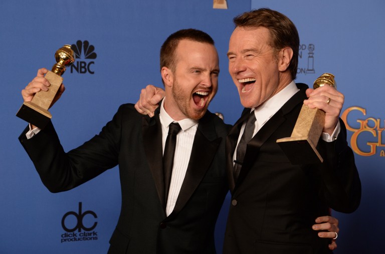 Actors Aaron Paul (L) and Bryan Cranston (R) celebrate winning Best Series - Drama for 