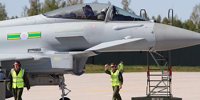 TO GO WITH AFP STORY BY VAIDOTAS BENIUSIS  Eurofighter Typhoons of the British Royal Air Force are seen at an air force base near Siauliai Zuokniai, Lithunaia, on April 28, 2014. The aircraft will strengthen the Polish Air Contingent which will take over the NATO Baltic Air Policing Mission from the United States.  AFP PHOTO / PETRAS MALUKAS
