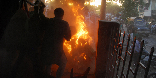 Indian bystanders attempt to douse the blaze as Bahujan Samaj Party, (BSP)Kamruzzama Fauji and a man named by police as Durgesh Kumar Singhb are engulfed in flames during an election television debate in a local park in Sultanpur, a town about 160 kilometres (100 miles) from the city of Lucknow.  A television debate show in northern India has ended in horror after a spectator set himself ablaze and embraced a local politician, leaving both men fighting for their lives, police and a witness told AFP. The election show on India's state-owned national TV channel Doordarshan was being recorded in a park on in Sultanpur, a town about 160 kilometres (100 miles) from the city of Lucknow.  AFP PHOTO