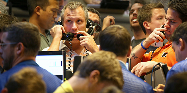 CHICAGO, IL - OCTOBER 16:  Traders take orders in the Standard & Poor's 500 stock index options pit at the Chicago Board Options Exchange (CBOE) on October 16, 2013 in Chicago, Illinois. The major stock indices reacted favorably today as it appeared a deal that would end the government shutdown was close to being reached.  (Photo by Scott Olson/Getty Images)