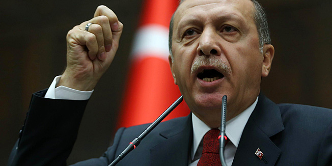 Turkey's prime minister Recep Tayyip Erdogan delivers a speech to the members of parliament from his ruling AK Party (AKP) during a meeting at the Turkish parliament in Ankara April 22, 2014. Turkey's prime minister will tour several European countries next month, a government source said on Tuesday, as he reaches out to expat Turkish voters ahead of a possible run for the presidency. Recep Tayyip Erdogan is planning to visit Germany, France and the Netherlands in May, the source said. Each has a large Turkish population that he is hoping to court ahead of presidential elections in August.    AFP PHOTO / ADEM ALTAN