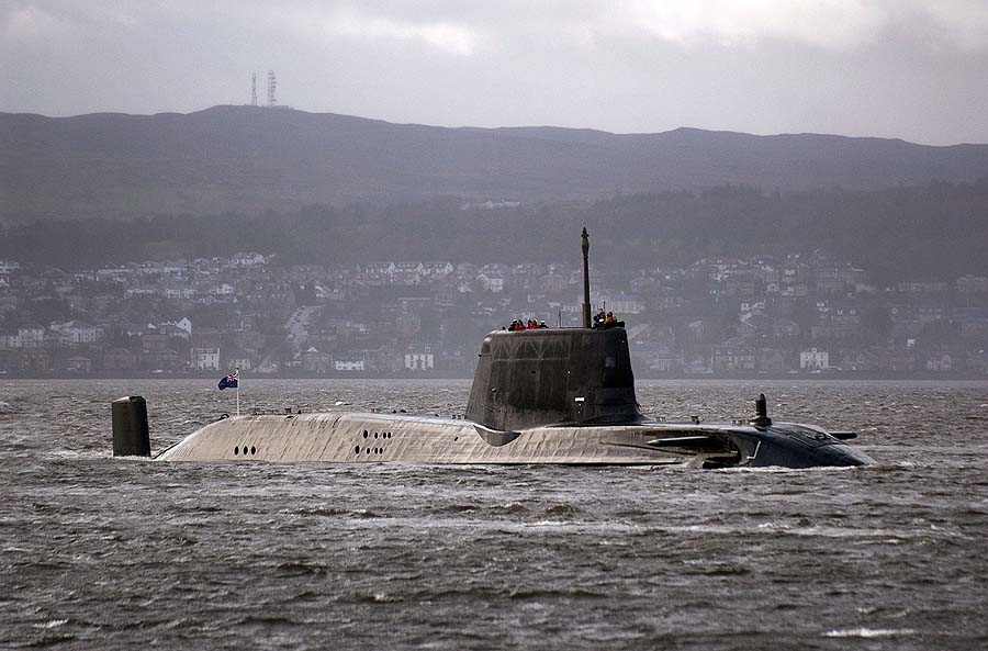 (FILES) A file photo taken on November 20, 2009, shows the British Royal Navy's nuclear submarine, HMS Astute, en-route to her new base Faslane, on the Firth of Cylde south-west Scotland. A man was arrested on April 8, 2011 after a shooting on board a British nuclear-powered submarine docked in the southern English port of Southampton, police said, adding that the incident was not terror-related. Two people are believed to have been injured in the incident on HMS Astute, the navy's newest submarine, they said, but could not confirm reports by local media that one of the people had died. AFP PHOTO / Andy Buchanan / FILES