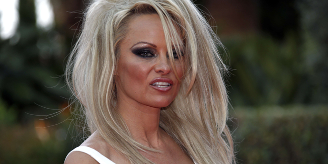 Pamela Anderson arrives at the World Music Awards at Monte Carlo Sporting Club on May 27, 2014 in Monaco.  AFP PHOTO / VALERY HACHE