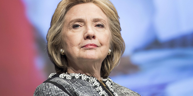TO GO WITH AFP TEXT BY Pierre-Henry DESHAYES - (FILES)  A picture taken on May 14, 2014 shows former Secretary of State Hillary Clinton waiting to speak at the World Bank  in Washington, DC.  AFP PHOTO / BRENDAN SMIALOWSKI