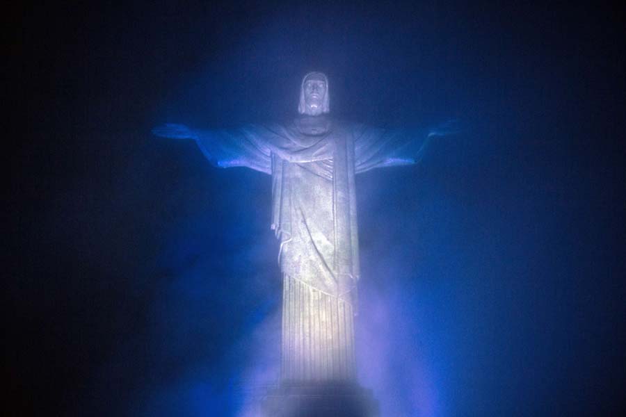 TOPSHOTSView of the statue of Christ the Redeemer illuminated in the colors of the Argentinian national flag in Rio de Janeiro, Brazil, on June 10, 2014, as part of an iniciative of tourism organisms of both countries called 