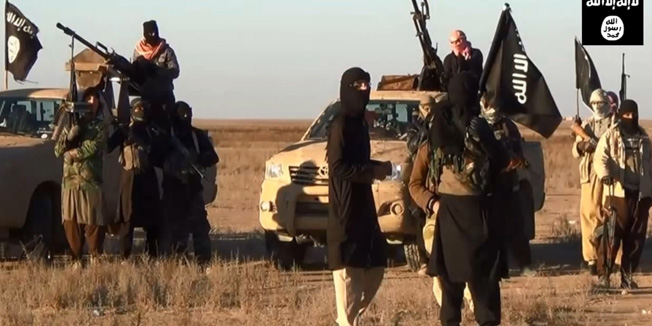 An image grab taken from a propaganda video uploaded on June 11, 2014 by jihadist group the Islamic State of Iraq and the Levant (ISIL) allegedly shows ISIL militants gathering at an undisclosed location in Iraq's Nineveh province. Militants took control of the Iraqi city of Tikrit and freed hundreds of prisoners today, police said, the second provincial capital to fall in two days. AFP PHOTO / HO / ISIL