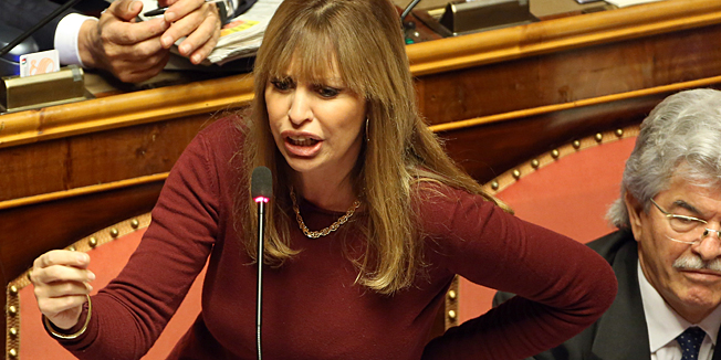 ROME, ITALY - NOVEMBER 27:  Italian Senator Alessandra Mussolini (Benito Mussolini's granddaughter and Sophia Loren's niece) holds her pro-Berlusconi speech during the discussion before the votes over Silvio  Berlusconi's Parliament expulsion on November 27, 2013 in Rome, Italy. Italian Senators will vote today on whether to expel the center-right leader and former Prime Ministre Silvio Berlusconi from parliament over a conviction for tax fraud.  (Photo by Franco Origlia/Getty Images)