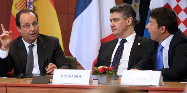 (From L) French President Francois Hollande talks to Croatian Prime Minister Zoran Milanovic and Italian Prime Minister Matteo Renzi during the second day of the EU summit on June 27, 2014 at the EU headquarters in Brussels. The leaders of the European Union signed on june 27 an Association Agreement (AA) with Ukraine, Georgia and Moldova, three former Soviet republics who want to get closer to Western Europe despite pressure from Russia. AFP POOL/ OLIVIER HOSLET