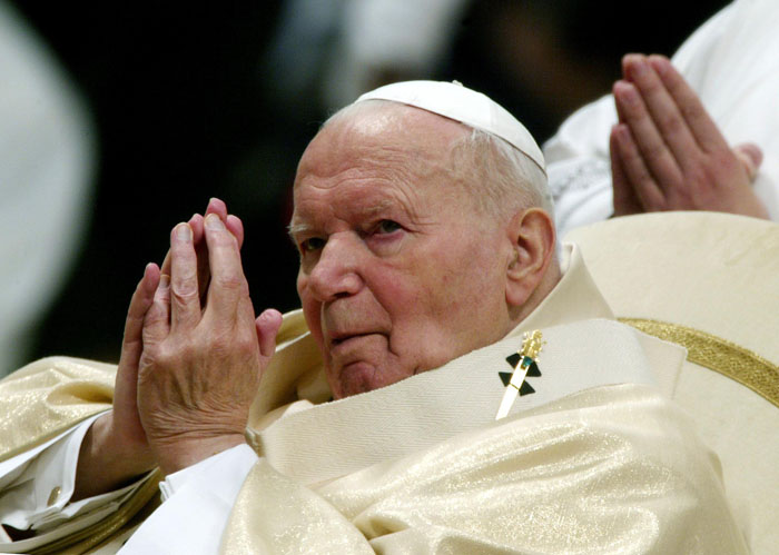 (FILES) This file picture taken on January 1, 2004 shows Pope John Paul II praying at St. Peter's Basilica in the Vatican during the celebration of a mass marking World Peace Day. It was announced on January 26, 2010 that the office of Pope John Paul II's cause of beatification published a letter dated 1989 where the pontiff was saying that he was willing to resign in case of incurable disease or if anything happended which could keep him from fulfilling his task.  AFP PHOTO / FILES /  PAOLO COCCO
