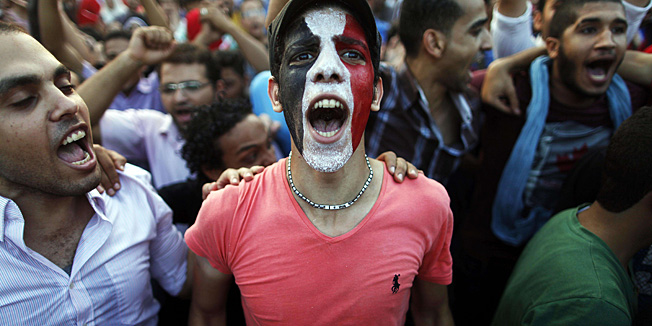 Egyptians shout slogans against President Mohamed Morsi and the Muslim Brotherhood as hundreds of thousands of Egyptian demonstrators gather at the presidential palace during a protest calling for the ouster of Morsi on July 1, 2013 in Cairo. The Egyptian army warned on Monday that if Morsi failed to meet the demands of the people within 48 hours, it would intervene with a roadmap of its own, after millions took to the streets to demand he step down. The military's statement, read out on state television, received a rapturous welcome from Morsi's opponents who have been camped out in Cairo's Tahrir Square and a muted response from his Islamist supporters.    AFP PHOTO/MAHMUD KHALED
