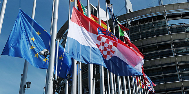 The Croatian flag flutters after being raised during a ceremony for Croatia's accession to the European Union on July 1, 201 at the European Parliament in Strasbourg, eastern France. Croatia woke up on Monday as the newest EU state after a night of celebrations dampened by fears that membership to the bloc could add to the recession-hit country's economic burden. AFP PHOTO/FREDERICK FLORIN