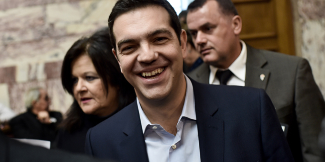 Greek Prime Minister Alexis Tsipras arrives at the parliament for a speech to his parliamentary group in Athens on February 17, 2015. Greece is forging ahead with reform measures which break its bailout obligations, with PM Alexis Tsipras saying  that parliament would vote on a series of social reform bills at the end of the week. The vote is scheduled to take place on February 20, the same day as a deadline imposed by Brussels on Athens to request an extension of the bailout, following a disastrous eurozone meeting on February 16. AFP PHOTO / ARIS MESSINIS