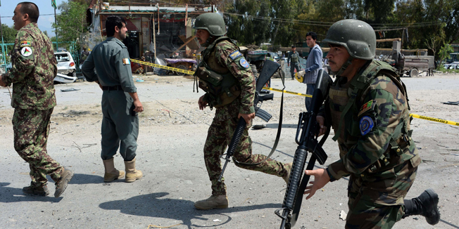 TOPSHOTSAfghan security personnel arrive at the site of a suicide car bomb attack targeting a NATO convoy near the airport in Jalalabad on April 10,2015. A suicide car bomb targeted a NATO convoy in eastern Afghanistan April 10, killing at least three civilians as security forces brace for the start of the Taliban's traditional spring offensive. AFP PHOTO / Noorullah Shirzada