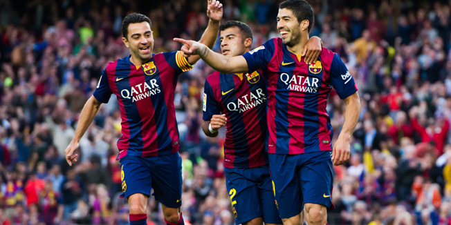 BARCELONA, SPAIN - APRIL 28: Luis Suarez (R) of FC Barcelona celebrates with his teammate Xavi Hernandez (L) and Rafinha (C) after scoring his team's second goal during the La Liga match between FC Barcelona and Getafe CF at Camp Nou on April 28, 2015 in Barcelona, Spain. (Photo by Alex Caparros/Getty Images)