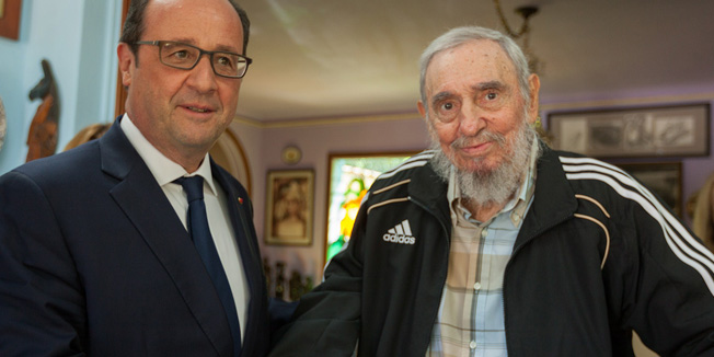 This handout picture released on Cuba Debate website shows French President Francois Hollande (L) posing for a picture with Cuban historical leader Fidel Castro during a meeting in Havana on May 11, 2015.  Hollande's Cuba trip, the first ever by a French leader, has highlighted the simultaneously cooperative and competitive relationship between the United States and the European Union as both look to increase business with Havana.    AFP PHOTO / CUBA DEBATE / ALEX CASTRO     == RESTRICTED TO EDITORIAL USE / MANDATORY CREDIT 