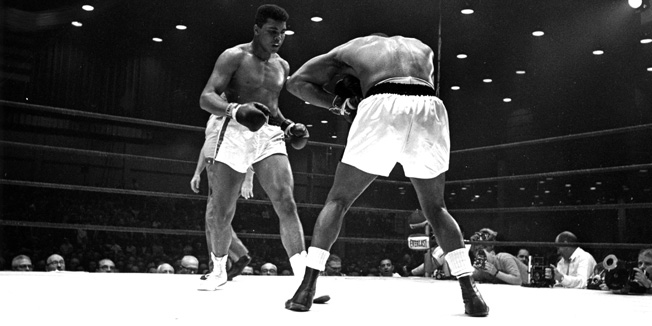 25th February 1964:  US boxers Cassius Clay (Muhammad Ali) and Sonny Liston (right) during their world heavyweight title fight at Miami Beach, Florida, which Ali went on to win.  (Photo by Harry Benson/Express/Getty Images)