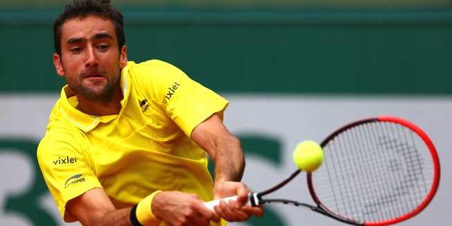 PARIS, FRANCE - MAY 28:  Marin Cilic of Croatia plays a backhand during his Men's Singles match against Andrea Arnaboldi of Italy on day five of the 2015 French Open at Roland Garros on May 28, 2015 in Paris, France.  (Photo by Clive Mason/Getty Images)