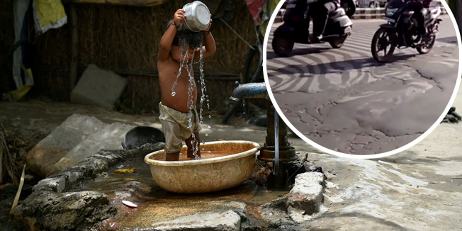 TOPSHOTSA young Indian child pours water on himself as he attempts to cool himself off in New Delhi on May 28, 2015. More than 1,100 people have died in a blistering heatwave sweeping India, authorities said, as forecasters warned searing temperatures would continue. AFP PHOTO/MONEY SHARMA.