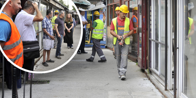 Zagreb, 230615.Zapoceli su pripremni radovi za rusenje devet objekata na trznici Branimirova. Radnici odpajaju struju i vodu dok vlasnici standova negoduju.Foto: Bruno Konjevic / CROPIX