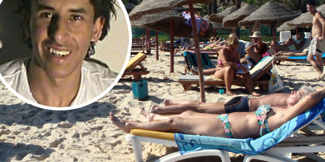 (FILES) - A file picture taken on October 31, 2013, shows tourists enjoying the beach near a four-star hotel in the resort town of Sousse, a popular tourist destination 140 kilometres (90 miles) south of the Tunisian capital. An attack on two tourist hotels in Sousse on June 26, 2015 killed several people, the interior ministry said. AFP PHOTO / BECHIR BETTAIEB