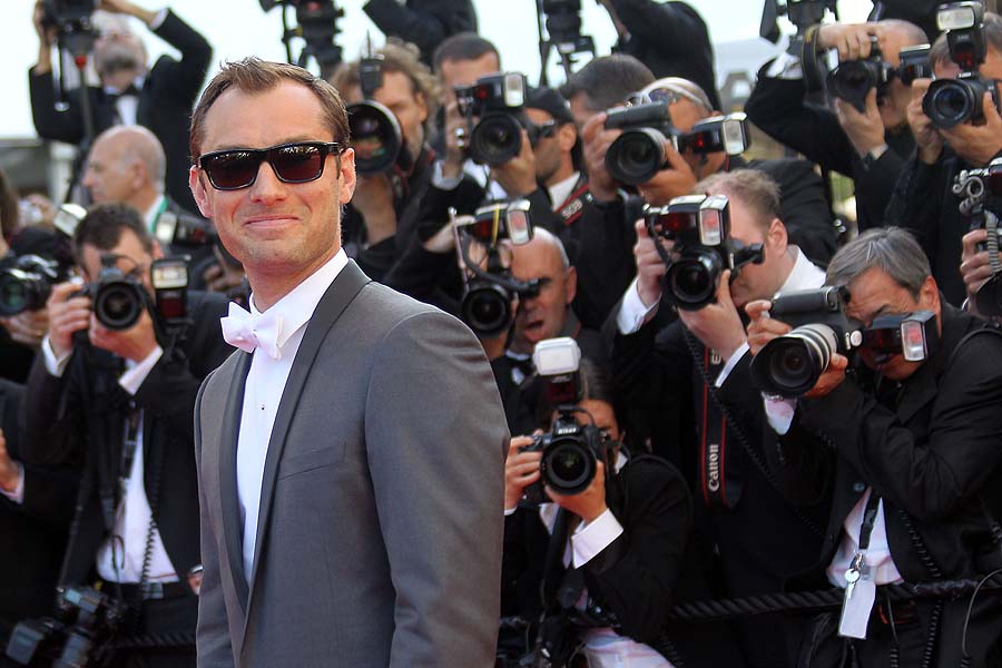 British actor Jude Law poses on the red carpet before the screening of 
