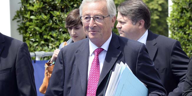 Centre-right European People's Party's (EPP) candidate for President of the European Commission Jean-Claude Juncker (3rd R) arrives to attend an EPP meeting in Kortrijk prior to an EU Summit on June 26, 2014. Britain's David Cameron headed for defeat at an EU summit Thursday after being abandoned by his allies in a battle over the next European Commission chief likely to mark Europe's future. Cameron's loud campaign to block the nomination of Jean-Claude Juncker as head of the powerful EU executive is set to flop, raising fears this could reinforce a growing push in Britain to exit the European Union.  AFP PHOTO / THIERRY CHARLIER