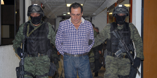 This handout picture released by General Attorney press office shows Hector Beltran Leyva, leader of the Beltran Leyva's drug cartel, during a press conference at the headquarters of the General Attorney in Mexico City, on October 1, 2014 after Beltran Leyva, aka the 