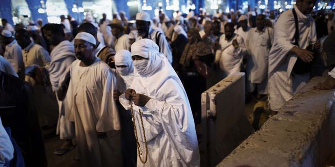 Muslim pilgrims leave after the esha'a prayer at Mecca's Grand Mosque, on September 28, 2014 as hundreds of thousands of Muslims have poured into the holy city of Mecca for the annual hajj pilgrimage. The hajj is one of the five pillars of Islam and is mandatory once in a lifetime for all Muslims provided they are physically fit and financially capable.   AFP PHOTO/MOHAMMED AL-SHAIKH