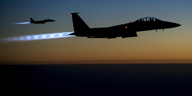 This US Air Forces Central Command photo released by the Defense Video & Imagery Distribution System (DVIDS)  shows a pair of US Air Force F-15E Strike Eagles flying over northern Iraq early in the morning of September 23, 2014 after conducting airstrikes in Syria.  These aircraft were part of a large coalition strike package that was the first to strike ISIL targets in Syria.  AFP PHOTO / US Air Force / Senior Airman Matthew Bruch (Released)     == RESTRICTED TO EDITORIAL USE / MANDATORY CREDIT: 