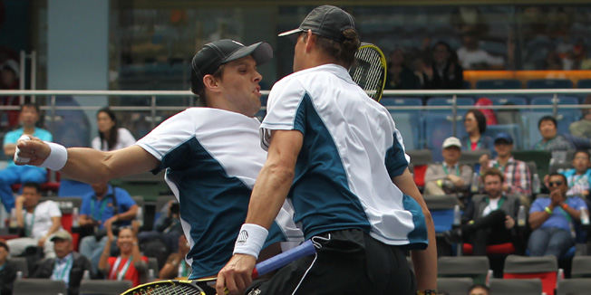 SHANGHAI, CHINA - OCTOBER 12: Bob Bryan of USA and Mike Bryan of USA reacts after winning their doubles final match against Julien Benneteau of France and Edouard Roger-Vasselin of France during the day 8 of the Shanghai Rolex Masters at the Qi Zhong Tennis Center on October 12, 2014 in Shanghai, China. (Photo by Zhong Zhi/Getty Images)