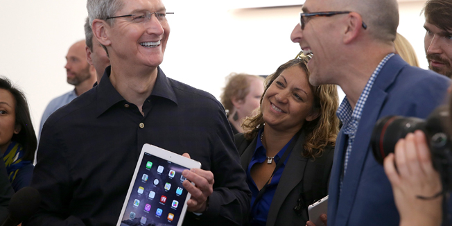 CUPERTINO, CA - OCTOBER 16: Apple CEO Tim Cook holds the new iPad Air 2 as he speaks with reporters during an Apple special event on October 16, 2014 in Cupertino, California. Apple unveiled the new iPad Air 2 and iPad Mini 3 tablets and the iMac with 5K retina display.   Justin Sullivan/Getty Images/AFP== FOR NEWSPAPERS, INTERNET, TELCOS & TELEVISION USE ONLY ==