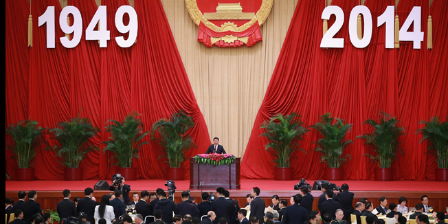 BEIJING, CHINA - SEPTEMBER 30: Chinese President Xi Jinping (C) delivers his speech for the National Day reception marking the 65th anniversary of the founding of the People's Republic of China at The Great Hall Of The People on September 30, 2014 in Beijing, China. China celebrates its 65th founding anniversary on 01 October which marks the beginning of the Golden Week National Day holidays.  (Photo by Feng Li/Getty Images)