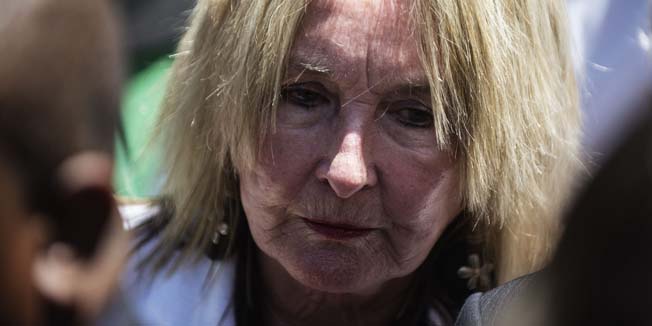 June Steenkamp, mother of Reeva Steenkamp, leaves the High Court in Pretoria on October 21, 2014. South African paralympic athlete Oscar Pistorius was sentenced by Judge Thokozile Masipa to up to five years in jail for the shooting and killing of his girlfriend Reeva Steenkamp on Valentine's Day 2013 at his home in South Africa. AFP PHOTO/GIANLUIGI GUERCIA
