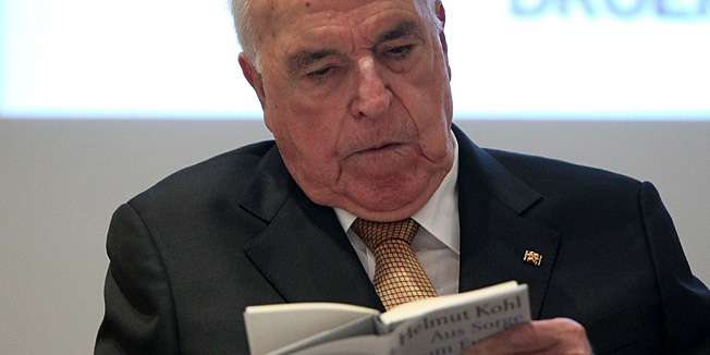 Former German Chancellor Helmut Kohl's reads his book during the presentation of Kohl's book titled 
