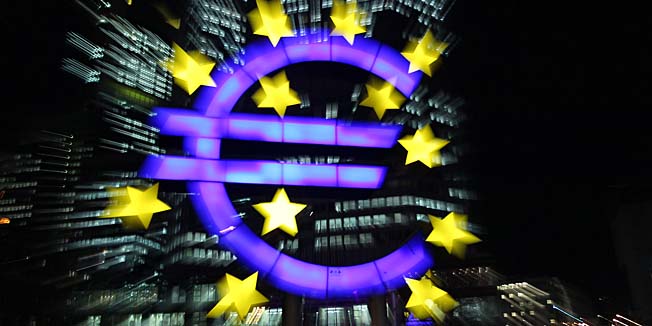 FILES - The illuminated EURO sign is seen in front of the European Central Bank, ECB in Frankfurt am Main, western Germany, on January 10, 2013. Economy and finance ministers from the 28 European Union countries gave the final green light to Latvia on July 9, 2013 to join the eurozone on January 1, 2014.    AFP PHOTO / DANIEL ROLAND