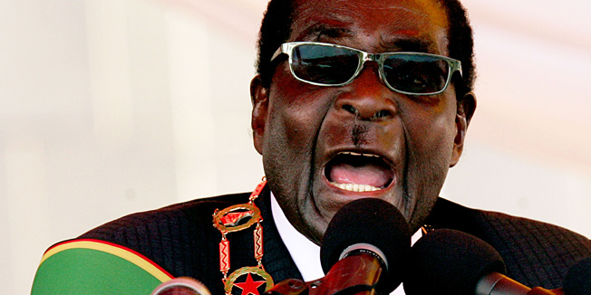 Zimbabwe President Robert Mugabe delivers a speech at the National Heroes Acre in Harare on August 12, 2013 during Heroes Day celebrations. Mugabe told those upset by his disputed landslide election win to 