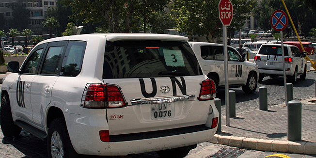 A convoy of United Nations (UN) vehicles leave a hotel in Damascus on August 26, 2013 carrying UN inspectors travelling to the site of a suspected deadly chemical weapon attack the previous week in Ghouta, east of the capital. The Syrian authorities approved the UN inspection of the site, but US officials said it was too little, too late, arguing that persistent shelling there in recent days had 
