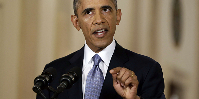 US President Barack Obama addresses the nation in a live televised speech from the East Room of the White House in Washington, Tuesday, September 10, 2013.   Obama blended the threat of military action with the hope of a diplomatic solution as he works to strip Syria of its chemical weapons.     AFP PHOTO / Pool / Evan Vucci