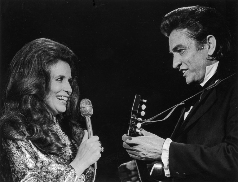 UNDATED PHOTO:  (FILE PHOTO) Married country singers Johnny Cash (R) and June Carter Cash perform a duet in 1975 on stage. Johnny Cash died September 12, 2003 in a hospital in Nashville, Tennessee while being treated for a stomach complaint. He was 71.  (Photo by Getty Images)