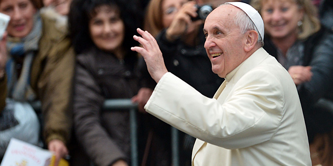 Pope Francis waves to the crowd as he arrives to lead a prayer at the statue of Virgin Mary during the annual feast of the Immaculate Conception at Piazza di Spagna (Spanish Steps) in Rome on December 8, 2013.     AFP PHOTO / GABRIEL BOUYS