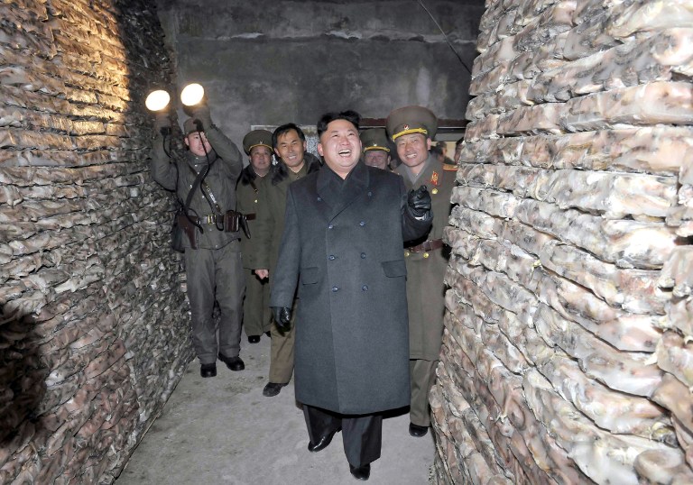 This undated picture released from North Korea's official Korean Central News Agency (KCNA) on December 16, 2013 shows North Korean leader Kim Jong-Un (C) visiting the August 25 Fisheries Station under Korean Peoples' Army (KPA) 313 Unit. Kim spent a whirlwind weekend making public appearances around the country which analysts said were intended to demonstrate his firm grip on power following the shock execution of his uncle.  AFP PHOTO / KCNA via KNS    REPUBLIC OF KOREA OUT THIS PICTURE WAS MADE AVAILABLE BY A THIRD PARTY. AFP CAN NOT INDEPENDENTLY VERIFY THE AUTHENTICITY, LOCATION, DATE AND CONTENT OF THIS IMAGE. THIS PHOTO IS DISTRIBUTED EXACTLY AS RECEIVED BY AFP. ---EDITORS NOTE--- RESTRICTED TO EDITORIAL USE - MANDATORY CREDIT 