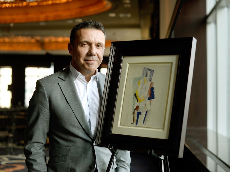 (FILES) A picture taken on December 3, 2013 in New York, shows Olivier Picasso, Pablo Picassos grandson, posing with the painting entitled 