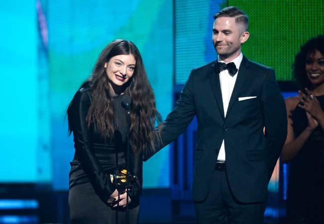 Singer/songwriter Lorde (L) and songwriter Joel Little accept the Song of the Year award for 'Royals' onstage during the 56th GRAMMY Awards at Staples Center on January 26, 2014 in Los Angeles, California.     Kevork Djansezian/Getty Images/AFP== FOR NEWSPAPERS, INTERNET, TELCOS & TELEVISION USE ONLY ==