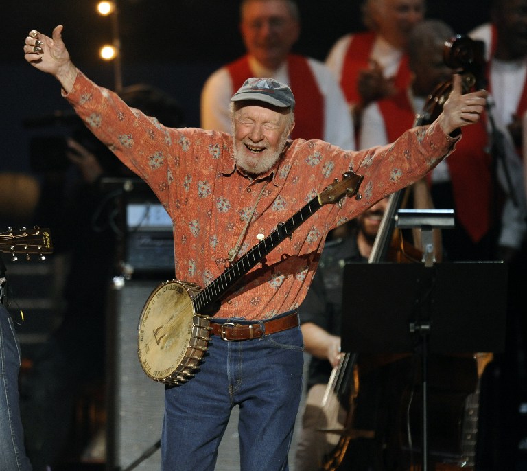 Folk music legend Pete Seeger acknowledges the crowd during a concert marking his 90th birthday at Madison Square Garden in New York onMay 3, 2009. Proceeds from the show will go to Hudson River Sloop Clearwater, an organization founded by the singer 40 years ago to preserve and protect the Hudson River.          AFP PHOTO/TIMOTHY A. CLARY