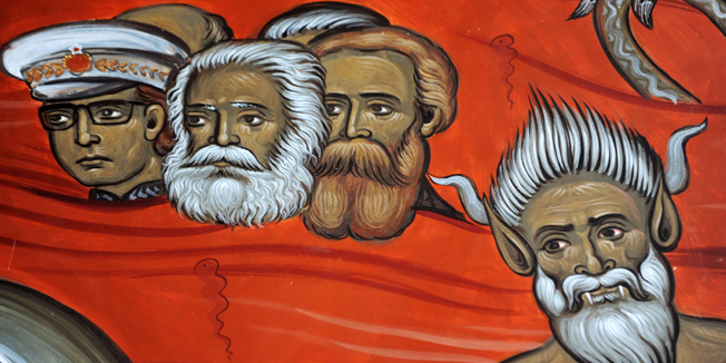 This picture taken on January 31, 2014, shows a fresco with the portraits of late German philosophers Karl Marx  (2nd L) and Friedrich Engels (3rd L), alongside Yugoslav communist leader Tito (L) and a demon (R), painted in an Orthodox church fresco scene of sinners in hell, in the newly-built 