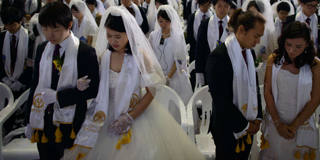 TOPSHOTSCouples attend a mass wedding at an event held by the Unification Church in Gapyeong on February 12, 2014. Unification Church members forming 2500 couples from 52 countries were married in a mass wedding in South Korea -- only the second such event since the death of their 
