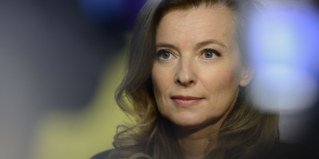 (FILES)-- A file photo taken on December 2, 2013 shows Valerie Trierweiler, ex-partner of the French president, giving a press conference after attending a class for disabled children at a school in Creteil, outside Paris. Valerie Trierweiler said on February 7, 2014 that she would file a complaint for 